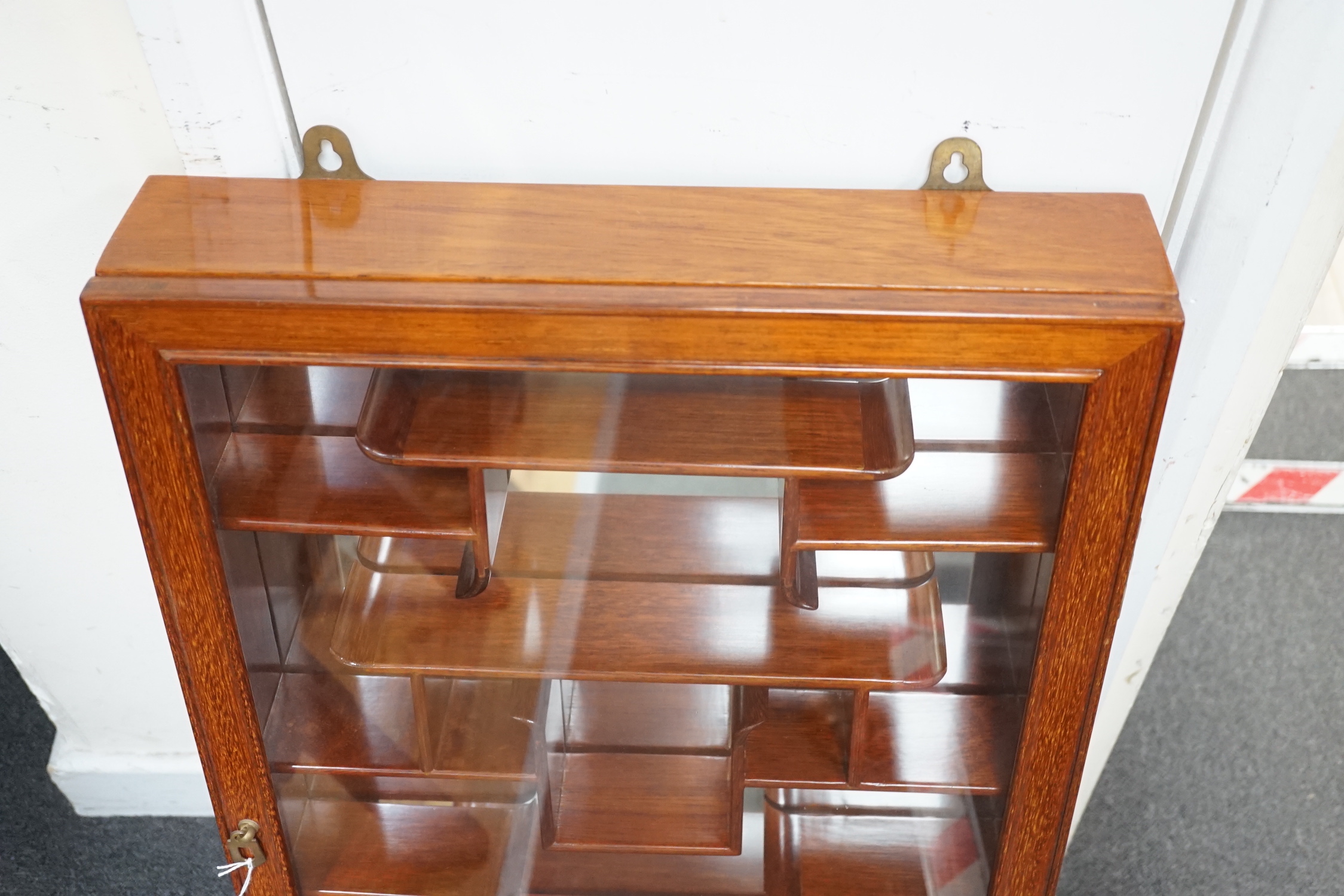 A Chinese hardwood snuff bottle display cabinet, width 46cm, depth 10cm, height 76cm